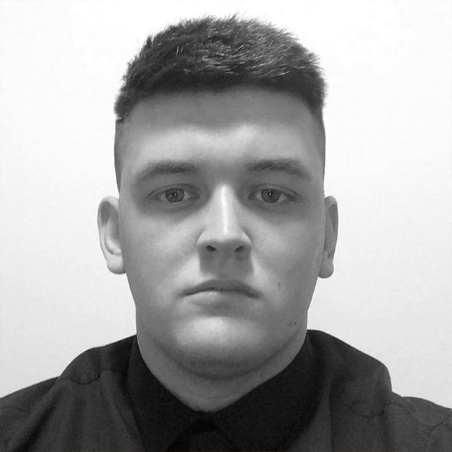 Black and white headshot of Eliot Schofield.