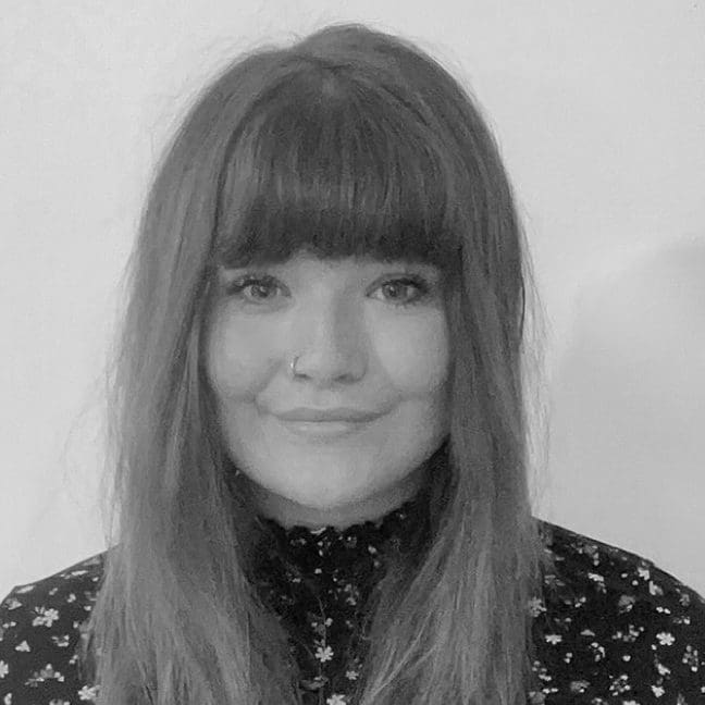 Black-and-white headshot of Ellie White.