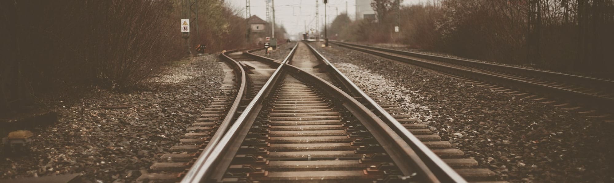 Sepia image of a railway line going off into the distance