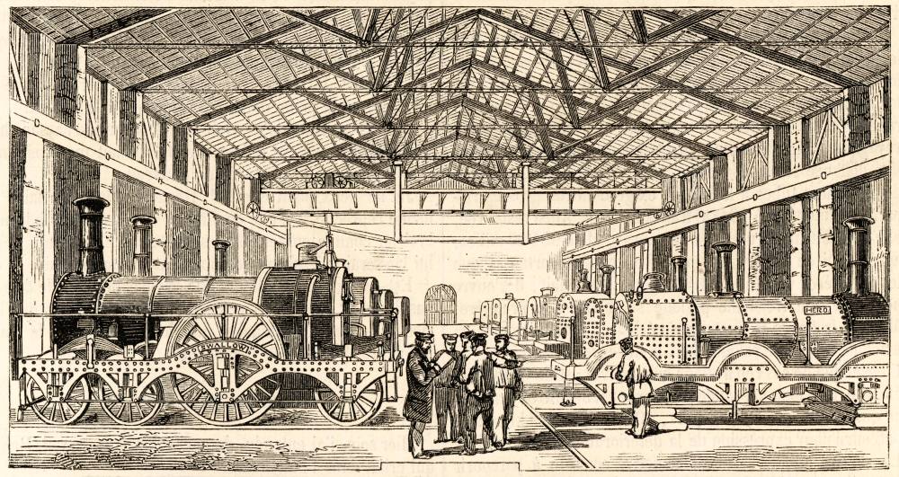 Historic illustration of early steam locomotives inside a large workshop with workers gathered and machinery visible.