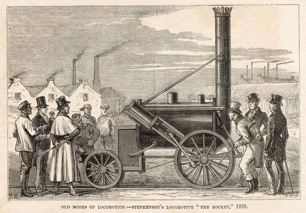 Historic illustration of early steam locomotive with people gathered around in an industrial setting.